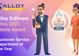 Man holding a trophy, celebrating Alloy Software's 2023 award,