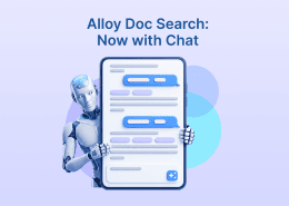 Banner reading “Alloy Doc Search: Now with Chat,” featuring a robot holding a large chat interface.